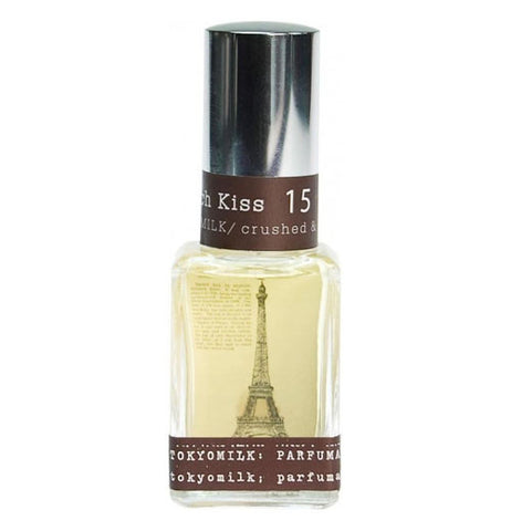 perfume is in a clear bottle with the Eiffel tower and brown edges.