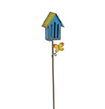 The Butterfly House has a blue house with a light green roof with a yellow butterfly attached to a metal pole. 