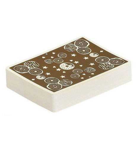 Deck of "Donut Lover's" playing cards stacked shown from the side with brown and white donut, star, and diamond design on a white background.