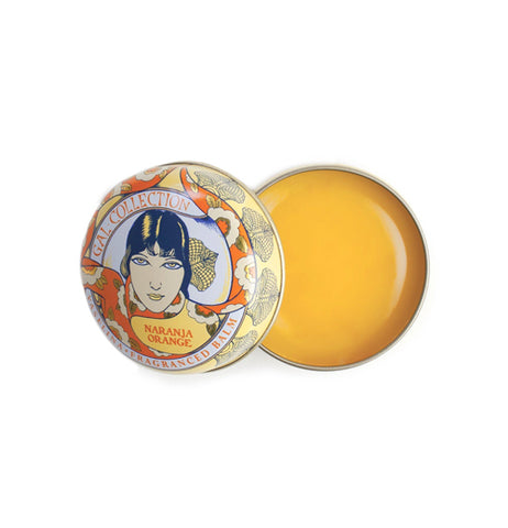 A circular orange and yellow art neaveau tin has orange lip balm in it.