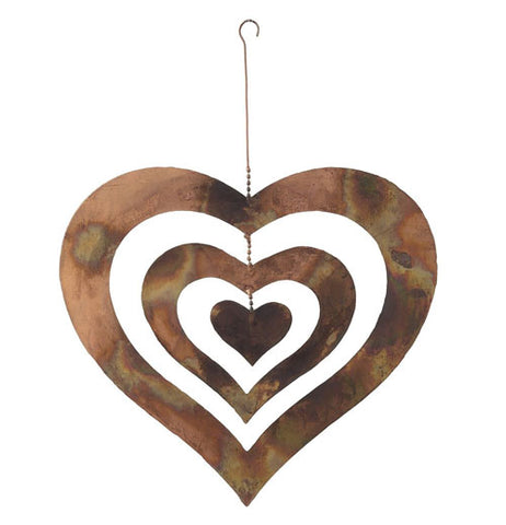 Copper garden triple heart spinner with chain and hook over a white background.