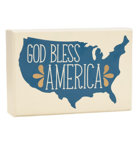 Box Sign that say's "God Bless America" in white with blue background shaped like the United States.