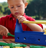 A child playing with a plastic tool set.