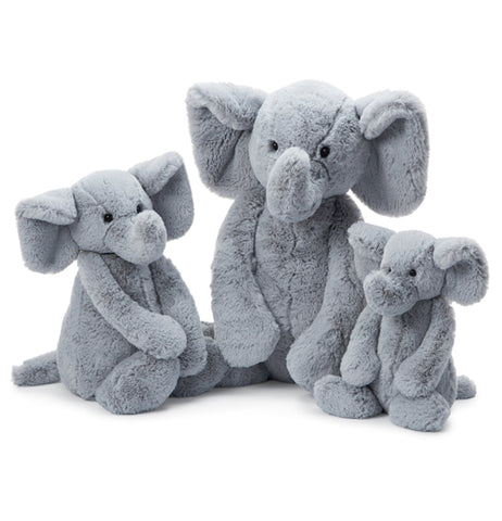The Bashful Medium "Grey Elephant" sits between two baby grey elephants. 
