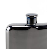 The top of the black metal flask is shown.
