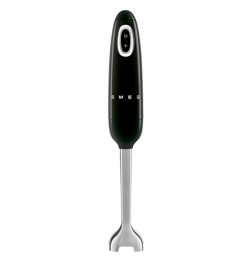 A handheld blender is stood on its&