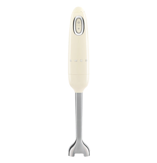 A handheld blender is stood on its&