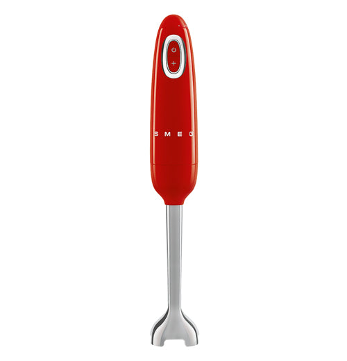 A handheld blender is stood on its&