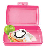 The penguin-shaped ice pack is shown inside a pink lunchbox with a sandwich and a green apple.