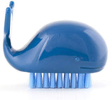 The dark blue whale-shaped brush with light blue bristles is shown individually.