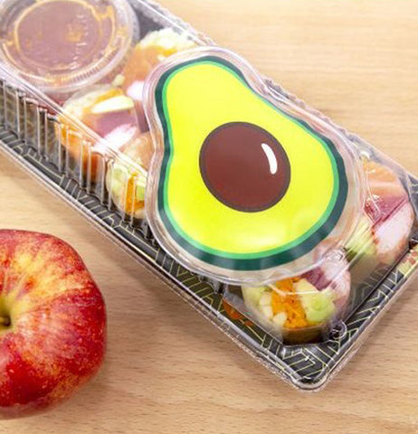 The "Avocado" Hot/Cold Pack is placed on top of a carton of food on a table. 