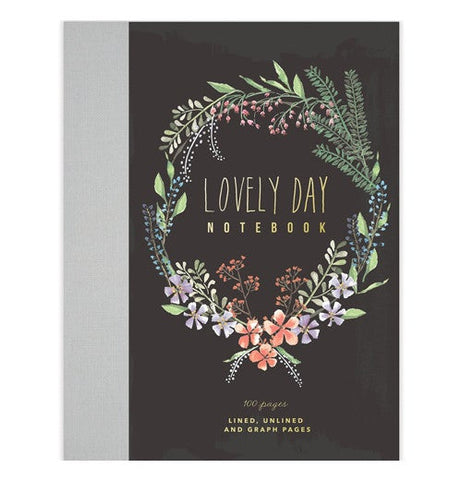 This notebook is black with a wreath of flowers and says "Lovely Day Notebook."