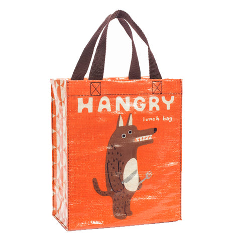 An orange bag with a caption and an angry looking dog with utensils in his paws. 