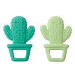 Two cactus teethers that are dark green and one light green; both with smiley faces.