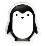 This black and white ice pack is shaped like a small penguin.