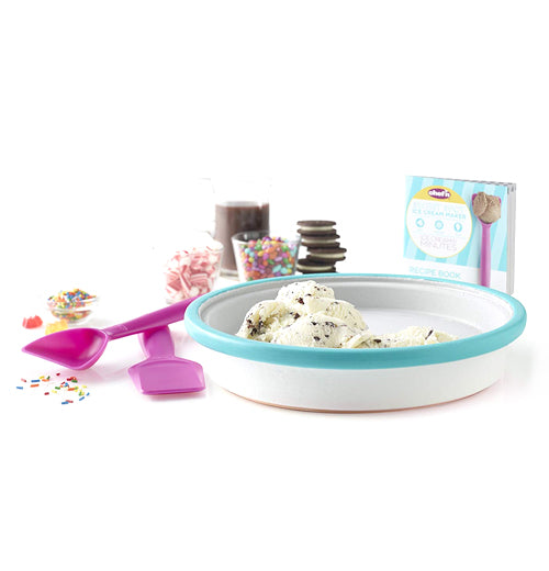 Vanilla ice cream with mints inside the turquoise edged pan with both the magenta spoons lying next to the pan