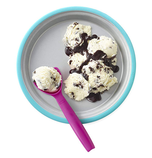 A spoon scoops ice cream out of the ice cream maker. on a white background.