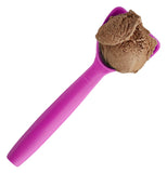 Chocolate ice cream scooped up in the deep shovel shaped magenta spoon