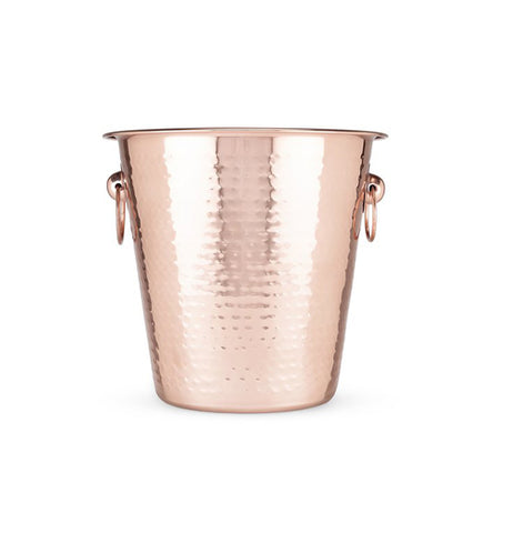 Hammered copper ice bucket with handles on the side.
