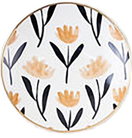A small white dish has yellow and black plants painted on it.