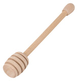 Wooden honey dipper for honey.