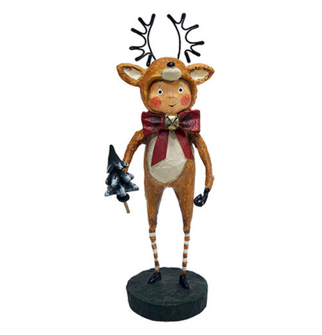 This figurine is of a rosy cheeked child dressed as a brown reindeer with antlers and a red bow around his neck. He holds a small snowy pine tree in his right hand.