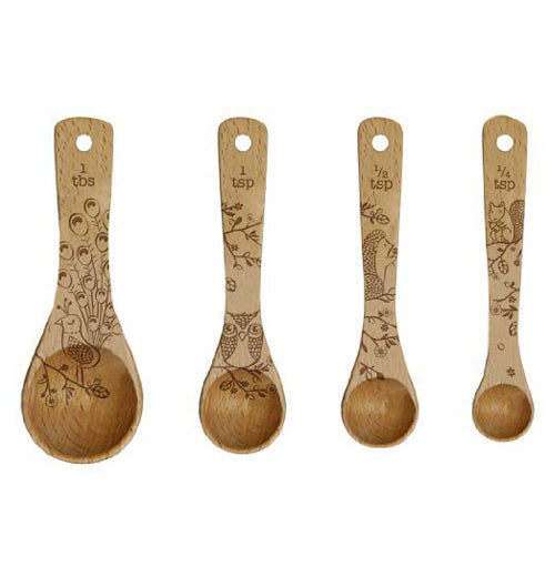 The four measuring spoons are shown individually side by side. The first has the picture of the peacock, the second has the picture of the owl, the third has the picture of the hedgehog, and the fourth has the image of the squirrel.