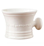 This hourglass-shaped cup has a circular handle and its logo, "Pre' De Provence" stenciled across its middle.