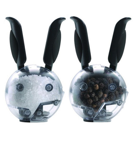 These are miniature magnetic grinders with long grip handles that look like rabbit ears. One contains white salt, while the other contains brown pepper.