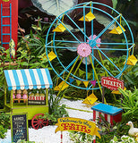 The white pebbles are shown as the base for a miniature fair setting, which includes a food stand, ticket stand, ferris wheel, and a "Welcome to the Fair" sign.