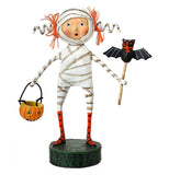 A mummy girl holding a bat wand while carrying a jack-o-lantern treat bucket