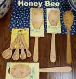 The Solid Beechwood "Honey Bee" utensils has the display of tools for the kitchen. 