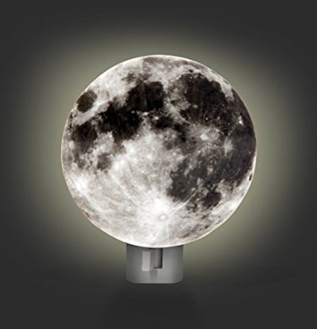 The moon shaped nightlight in the on position showing the glow