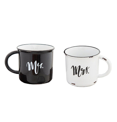 Two mugs are shown; one is black with a white interior and the word, "Mr." written on it in white lettering. The other is white with a black rim and the word, "Mrs." written on it in black lettering.