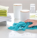 A blue bar mop similar to the white one is shown wiping down a table.