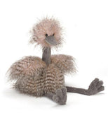 This Ostrich plushy is pink in color and has big grey legs and is in the sitting position.