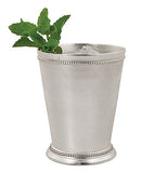 Silver plated mint julep cup with mint leaves in it.