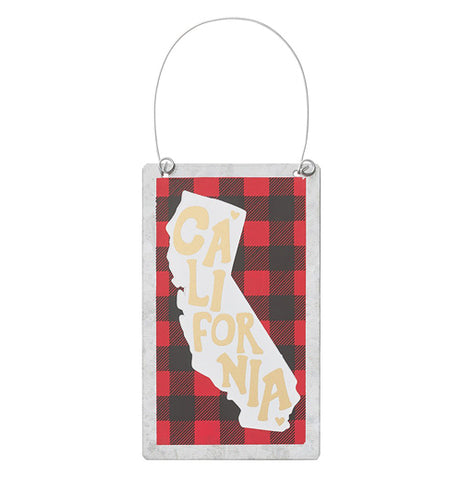 Rectangle metal ornament with a black and red checkered background with a shape of California on it with a wire hanger on it for hanging.