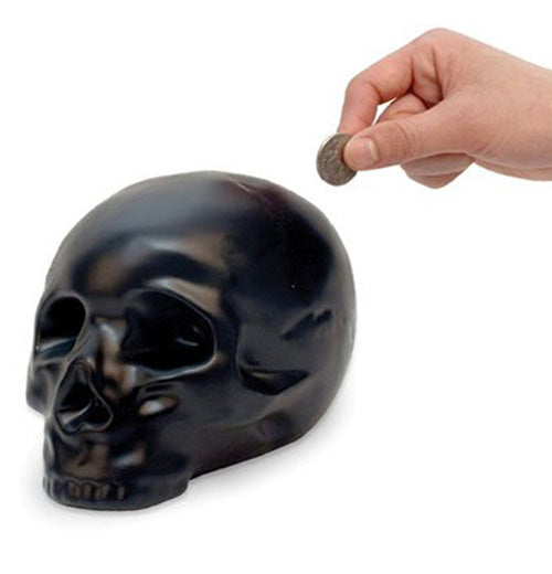 Someone putting change in their skull bank.