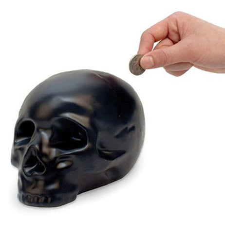 Someone putting change in their skull bank.