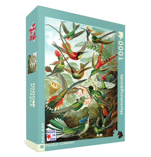 Diagonal view of "Hummingbirds" puzzle with different types of hummingbirds fluttering and sitting on fern leaves.