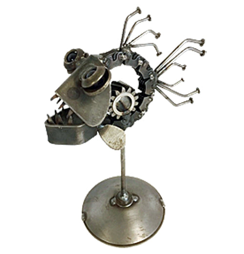 A sculpture of a piranha is made out of recycled metal. It&