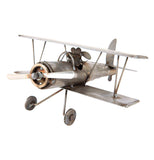 The metal biplane sculpture with the dog pilot is shown from an opposite angle.