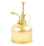 Fancy brass watering can.