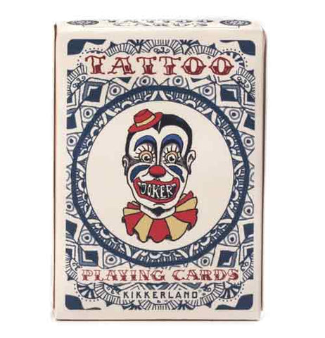 Front of the box of "Tattoo" playing cards with blue, red, and yellow circus clown head with red words that read "Tattoo Playing Cards" surrounded by a blue circle and diamond design.