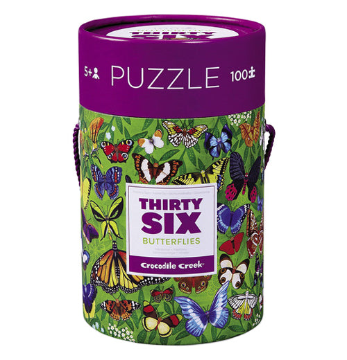 The "36 Butterflies" Puzzle with 100 pieces are in a green jungle-like canister with a purple lid. 