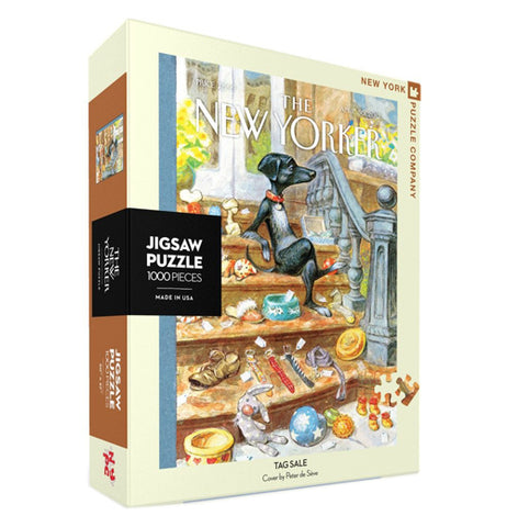 A box containing a 1000 piece jigsaw puzzle is shown with a picture of a black dog with food and random items strewn around a room. The words, "The New Yorker" are shown above the image in white lettering.