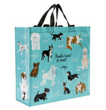 The "People to Meet: Dogs" Shopper Tote Bag has the images of different dogs on a light blue background  with the message that says, "People I Want to Meet: 1. Dogs". 