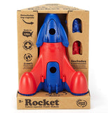 The blue and red rocket ship is shown inside its cardboard packaging, with the word, "Rocket" in black lettering at the bottom of the box.