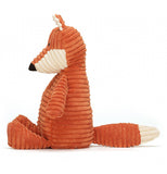 This is the side view of the orange and white fox toy. 